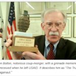 John Bolton with a grenade momento when he left USAID.